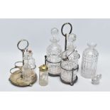A CUT GLASS THREE BOTTLE DECANTER STAND AND CRUET SET, the white metal decanter set with three cut