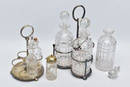 A CUT GLASS THREE BOTTLE DECANTER STAND AND CRUET SET, the white metal decanter set with three cut