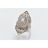 A LARGE LABRADORITE CABOCHON RING, designed with a central oval labradorite cabochon within a beaded