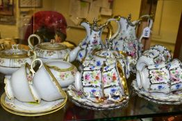 A CONTINENTAL PORCELAIN COFFEE SET, hand painted floral decoration between gilt and silver lustre