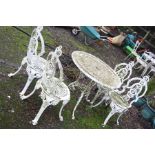 A WHITE CAST ALUMINIUM GARDEN TABLE 80cm in diameter and four similar chairs