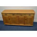 A BLONDE OAK PRIORY SIDEBOARD with four drawers above two bi-fold cupboard doors enclosing a