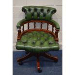 A REPRODUCTION MAHOGANY BUTTONED GREEN LEATHER SWIVEL OFFICE ARMCHAIR