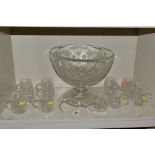 A CUT GLASS PUNCH BOWL, with twelve glasses and ladle, height of punch bowl approximately 26cm,