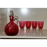 A 19TH CENTURY CRANBERRY GLASS DECANTER, together with four cranberry glass bowl wine glasses,