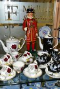 A ROYAL ALBERT 'NIGHT AND DAY' FIFTEEN PIECE COFFEE SERVICE AND A ROYAL STAFFORD 'ROSES TO REMEMBER'