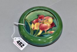 A SHALLOW MOORCROFT LIPPED FREESIA PATTERN BOWL, impressed backstamps, diameter approximately