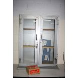 A VINTAGE METAL MEDICAL CABINET with two glazed doors two wood shelves 99cm wide 39cm deep and