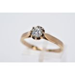 A 9CT GOLD SINGLE STONE DIAMOND RING, designed with an illusion set round brilliant cut diamond