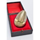 A STUART DEVLIN SILVER GILT EGG, the textured egg hallmarked silver London 1972 'Stuart Devlin',