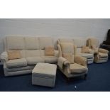 A FIVE PIECE OATMEAL/PALE ORANGE LOUNGE SUITE, comprising three seater and a two seater settee,