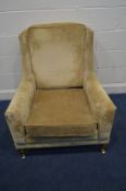 A DURESTA GOLD UPHOLSTERED ARMCHAIR on square tapering legs and brass caps and casters, width 81cm x