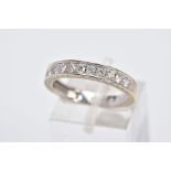 AN 18CT WHITE GOLD DIAMOND HALF ETERNITY RING, designed with a row of round brilliant cut