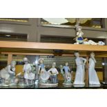 FOUR NAO FIGURES/GROUPS AND A NAO TABLE LAMP, comprising girl in nightdress, height 29cm, boy in