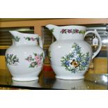 A GRADUATED PAIR OF ROYAL WORCESTER 'WORCESTER HERBS' PATTERN JUGS, printed designs, brown printed