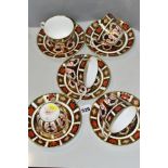 A MATCHED SET OF FIVE ROYAL CROWN DERBY 1128 IMARI PATTERN TEA CUPS AND SAUCERS, four cups and three