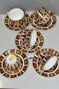 A MATCHED SET OF FIVE ROYAL CROWN DERBY 1128 IMARI PATTERN TEA CUPS AND SAUCERS, four cups and three