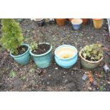 FOUR GLAZED GARDEN PLANT POTS largest being 33cm in diameter