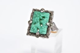 A MARCASITE RING, of rectangular form set with a carved floral green and white central panel