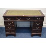 A MODERN MAHOGANY PEDESTAL DESK, with a green leather and gilt tool inlay top, above eight