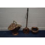 A BRASS AND COPPPER DOUBLE SIDED LOG BUCKET, with a turned handle together with a copper planter and