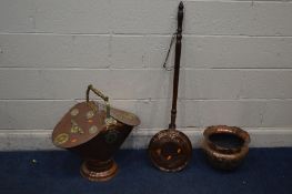A BRASS AND COPPPER DOUBLE SIDED LOG BUCKET, with a turned handle together with a copper planter and