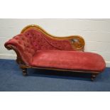 A VICTORIAN WALNUT CHAISE LONGUE, on turned legs and brass caps and casters, length 187cm