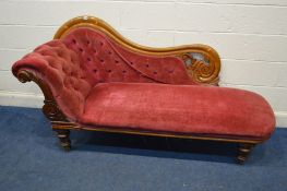 A VICTORIAN WALNUT CHAISE LONGUE, on turned legs and brass caps and casters, length 187cm