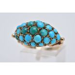 AN EARLY 20TH CENTURY TURQUOISE RING, of a marquise shape set with blue and green turquoise