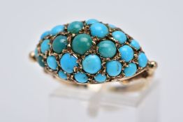 AN EARLY 20TH CENTURY TURQUOISE RING, of a marquise shape set with blue and green turquoise