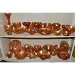 A COLLECTION OF ORANGE CARNIVAL GLASS, including bowls, vases, platters and jugs, approximately