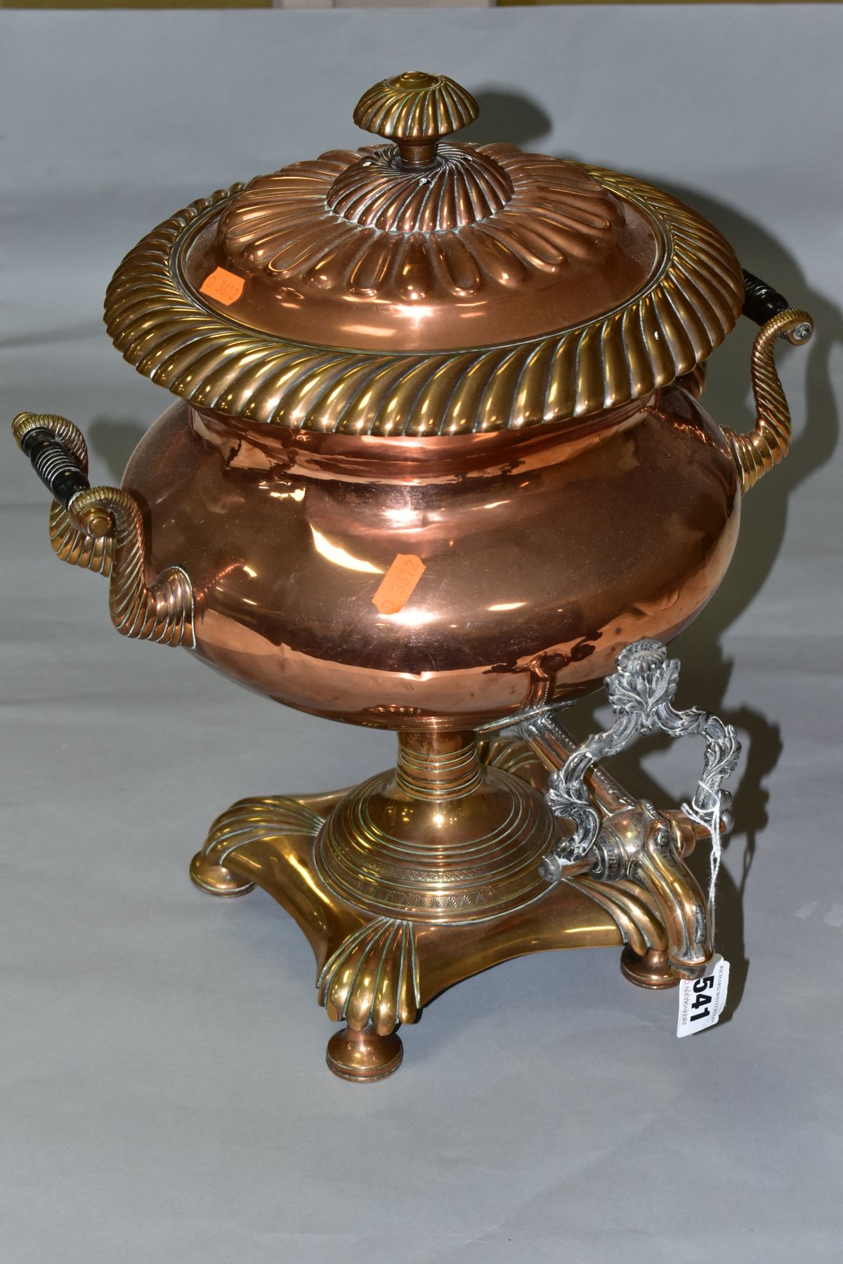 A VICTORIAN COPPER URN SAMOVAR, the circular pull off cover with fluted and gadrooned decoration,