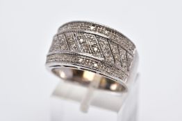 A 9CT WHITE GOLD WIDE DIAMOND DETAILED BAND, designed with a central section of asymmetrical rows