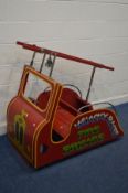 A VINTAGE CHILDS FAIRGROUND CAROSEL RIDE, in the form of a wooden fire engine, complete with