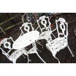 A WHITE CAST ALUMINIUM GARDEN TABLE 67cm in diameter and four similar chairs