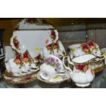 A ROYAL ALBERT OLD COUNTRY ROSES TWENTY THREE PIECE TEA SET, comprising six cups, six saucers, seven