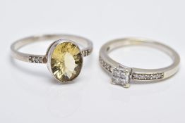 A 9CT WHITE GOLD DIAMOND RING AND A WHITE METAL CITRINE RING, the diamond ring designed with a