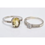 A 9CT WHITE GOLD DIAMOND RING AND A WHITE METAL CITRINE RING, the diamond ring designed with a