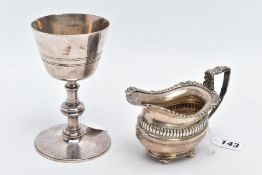 A SILVER CREAM JUG AND A WHITE METAL GOBLET, the Geo.V cream jug with a fluted panel to the body