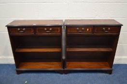 A PAIR OF MODERN MAHOGANY OPEN BOOKCASES with two drawers, width 76cm x depth 30cm x height 83cm