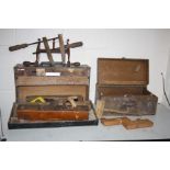 TWO VINTAGE WOODEN CARPENTERS TOOLBOXES including wooden planes, mallets, clamps, etc