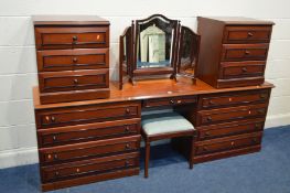 A MODERN MAHOGANY FIVE PIECE BEDROOM SUITE, comprising a long dressing table with eight drawers, a