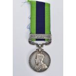 A GEORGE V MEDAL WITH RIBBON, round medal of 'North West Frontier 1930-31 India' awarded to '4384811