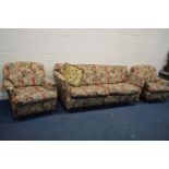 A NATURE AND FLORAL UPHOLSTERED THREE PIECE LOUNGE SUITE, on mahogany legs with brass caps and