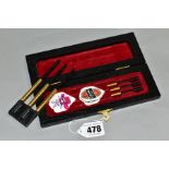 A SET OF ERIC BRISTOW 'THE CRAFTY COCKNEY' GOLD PLATED TUNGSTEN BARREL DARTS, from a limited edition