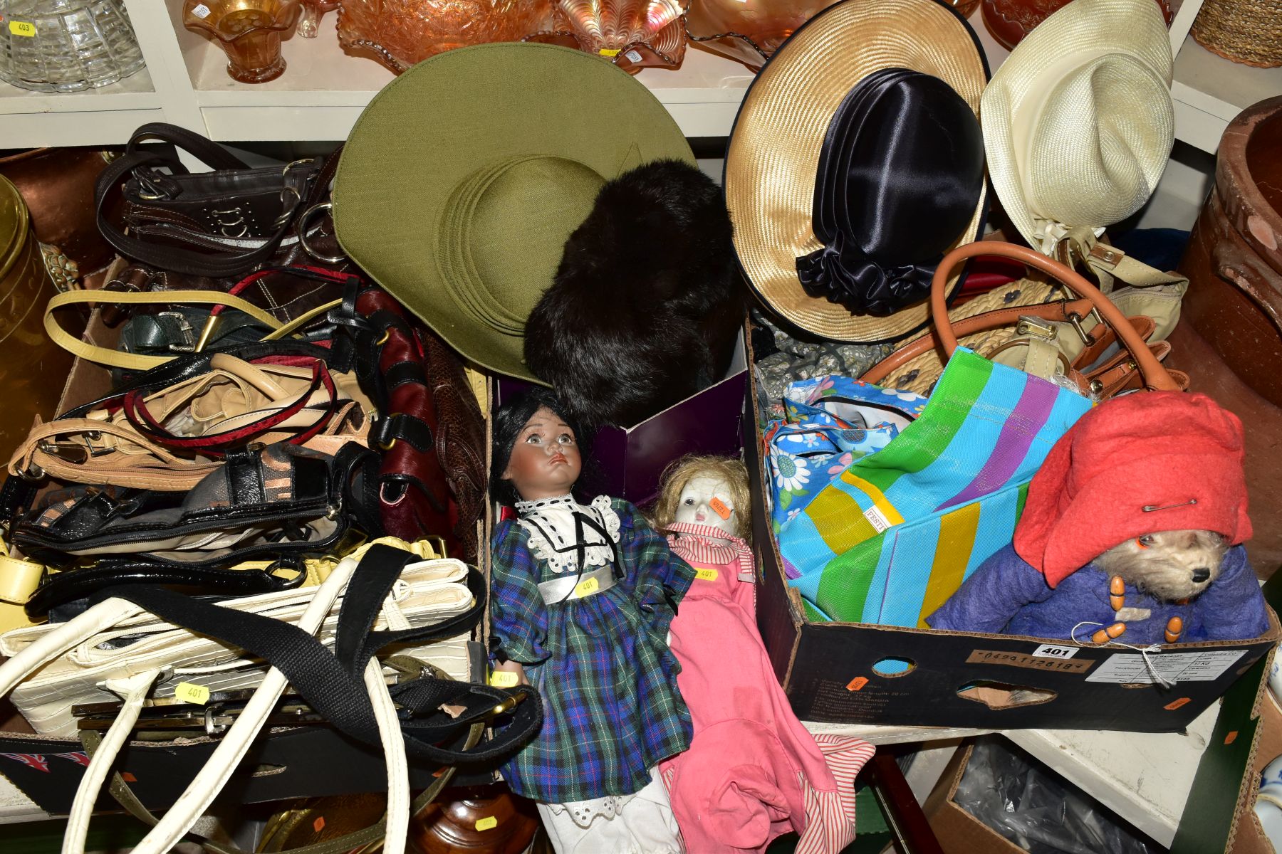 TWO BOXES OF HANDBAGS, LADIES HATS AND FASCINATORS, two modern collectors dolls, one damaged to