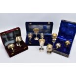 THREE CASED SETS OF WINE AND BRANDY METAL GOBLETS, assorted design each engraved in a foliate and