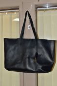 AN YVES SAINT LAURENT BLACK LEATHER TOTE BAG, with magnetic press stud clasp and integral zipped