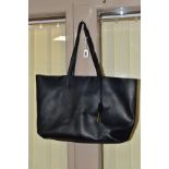 AN YVES SAINT LAURENT BLACK LEATHER TOTE BAG, with magnetic press stud clasp and integral zipped