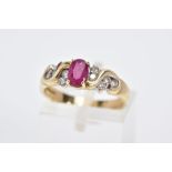 A 9CT GOLD RUBY AND DIAMOND RING, designed with a central oval cut ruby flanked with round brilliant